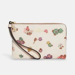 Coach side zip wristlet in floral pattern, coated canvas. NWT